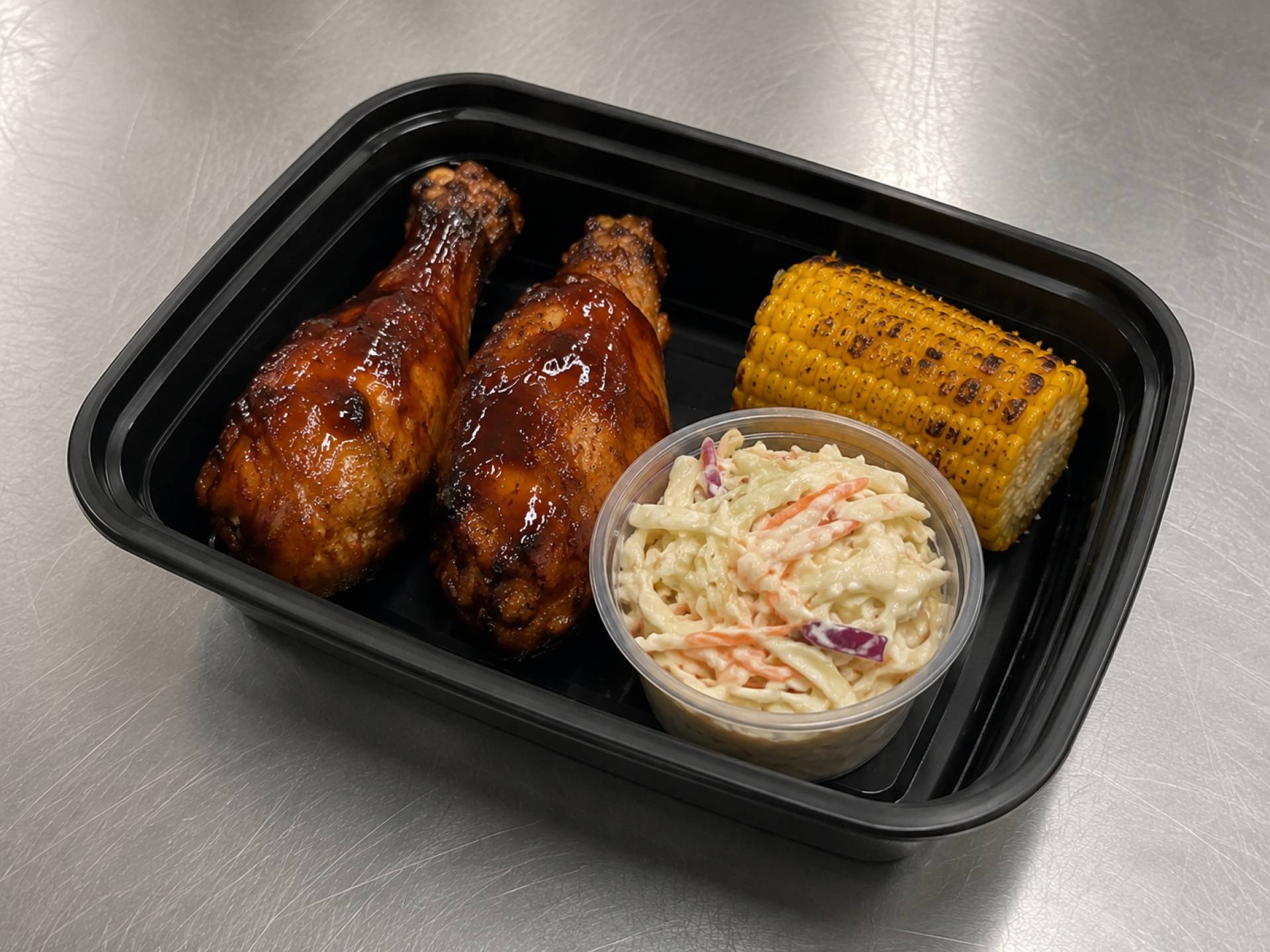 BBQ Chicken Drumsticks with Corn on the Cob and Coleslaw
